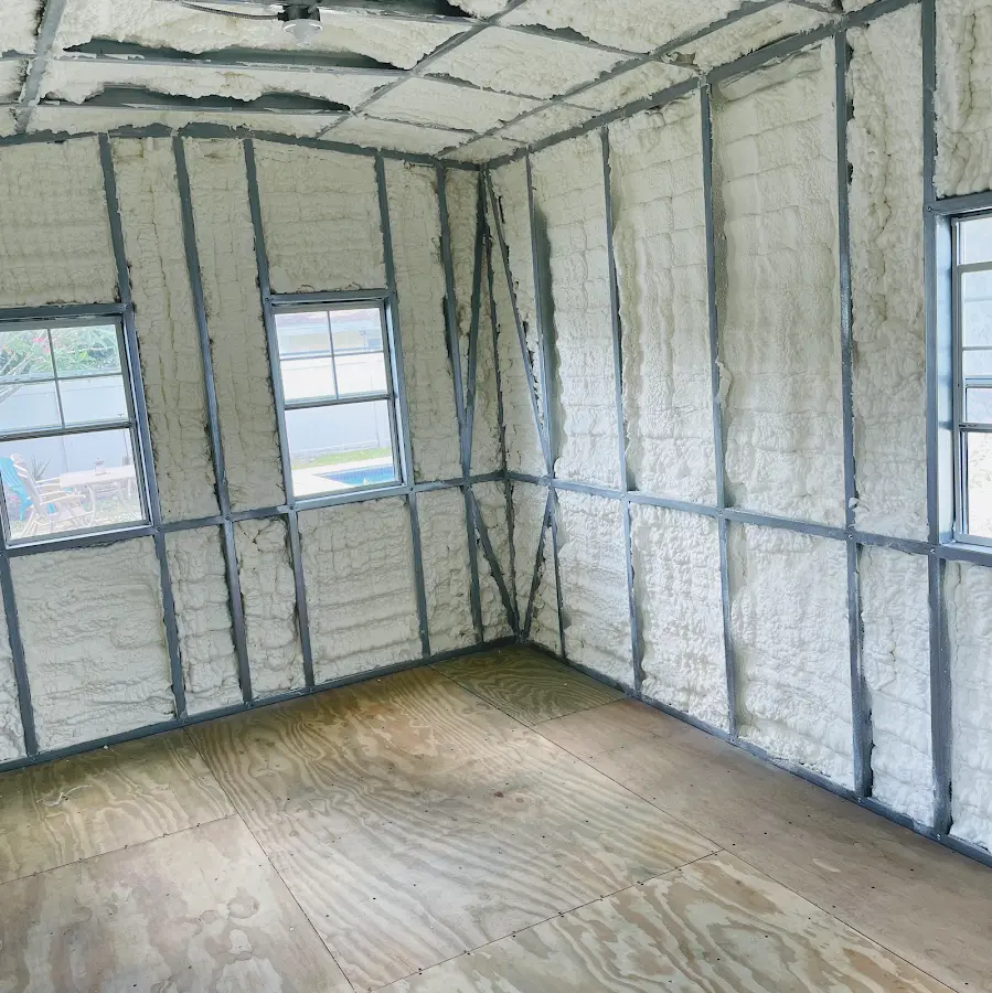 Closed-cell spray foam insulation applied to wall cavities in a residential project in Marengo